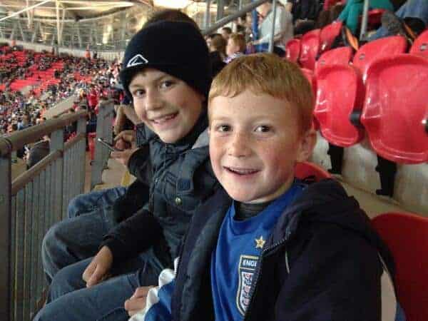 Two boys at a football stadium.